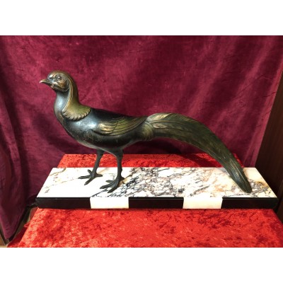Bronzefigur auf Marmorsockel Vogelmotiv
